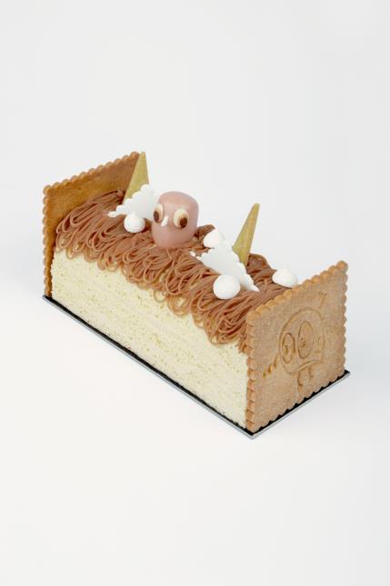 Une bûche ornée des petits oiseaux stylisés créés par l'artiste BishopParigo.