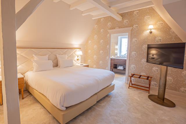 Une chambre supérieure située dans le manoir du Château de Noirieux. 